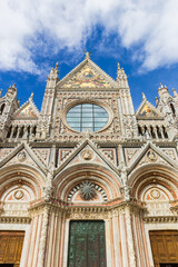 Front facade of the historic Duomo in Siena, Italy