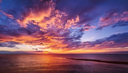 Obraz premium Dramatic sky background with vibrant colors of sunrise or sunset, perfect for landscape photography, travel content, or inspirational visuals