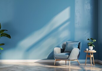 A blue armchair with a pillow sits in a room with a blue wall. wooden floor. and sunlight streaming through a window