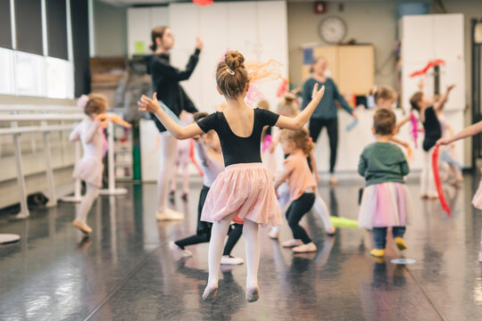 Cute little ballerina having fun on ballet room
