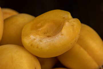ripe soft apricot fruits on the cutting board