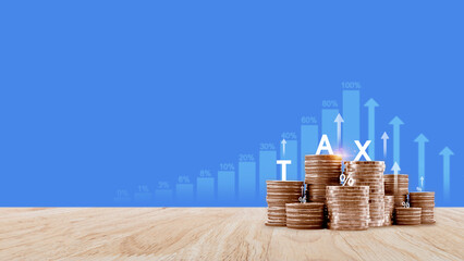 Tax concept. Income tax, savings, stack of coins represent the concept of tax return preparation...