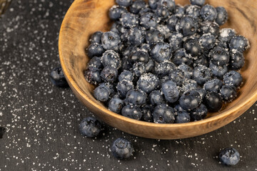 sprinkled with white sweet sugar juicy blueberry berries