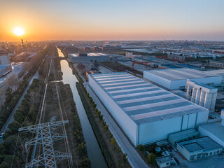 solar panel on roof of factory building during sunset