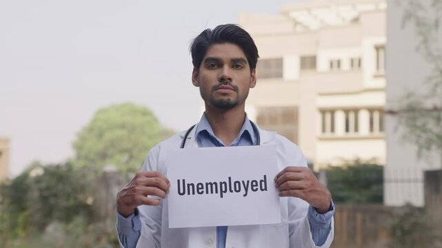 Indian Doctor Holding Unemployed Poster