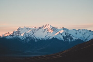 Majestic Snowcapped Mountains at Sunrise