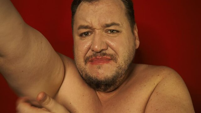Fat man and problems with excess weight. Red background.