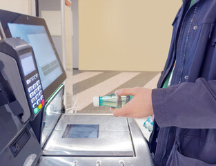Customer pays his purchase at the supermarket,self checkout systems in  retail stores,Barcode scanner,Self checkout machine