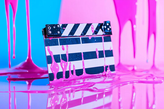Cinematic clapperboard with artistic paint drips, concept of creative films