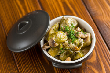 Brussel sprouts stewed in sour cream sauce with mushrooms and spices
