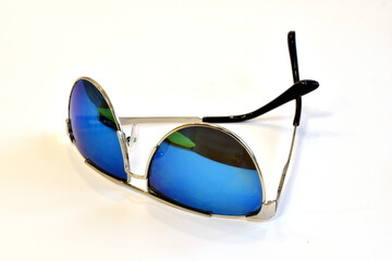 Sunglasses with mother-of-pearl lenses on a white background.