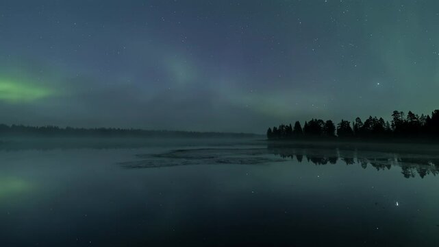 Auroras reflecting from a foggy lake