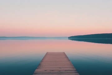 Obraz premium Wooden Dock Extending into Serene Pink Sunset Lake