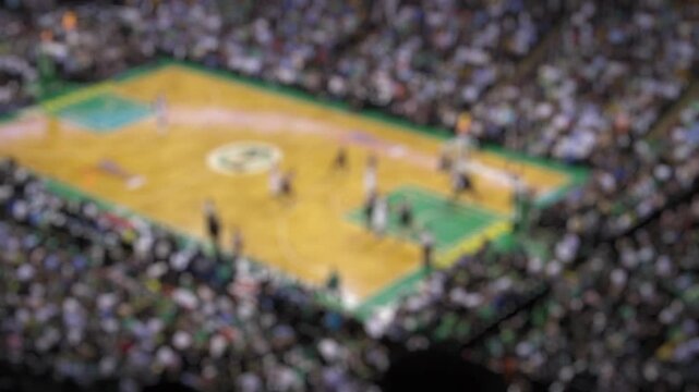 Blurred image of Spectators cheer as basketball players compete in a game. ideal for basketball concept footage backgrounds