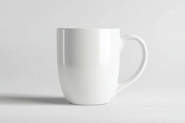 Fototapeta premium Empty white ceramic mug on a light background showcasing minimalist design and smooth curves, perfect for a beverage or decoration