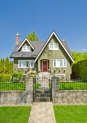 Two story stucco luxury house with nice summer  landscape in Vancouver, Canada, North America. Day time on June 2024.