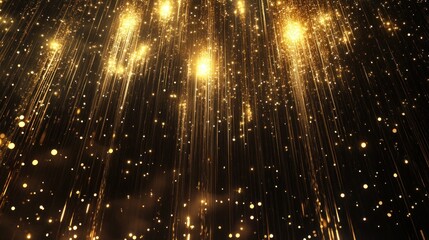 Golden light streaks and sparkles falling on black background.