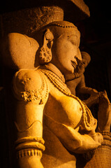 Carved sculpture of Hindu god and goddess at Meenakshi temple, Madurai, Tamil Nadu, India.