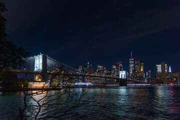 Brooklyn bridge and Manhattan seen from Brooklyn at night