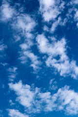 blue sky background with blurred light white clouds