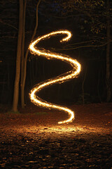 Obraz premium A skipping rope forming a figure-eight mid-air, glowing with energy