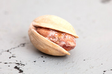 One salted pistachio close up 