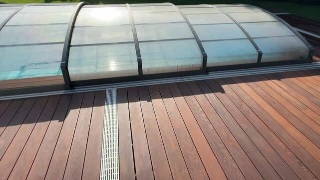 Swimming pool cover protection with deck wood floor around