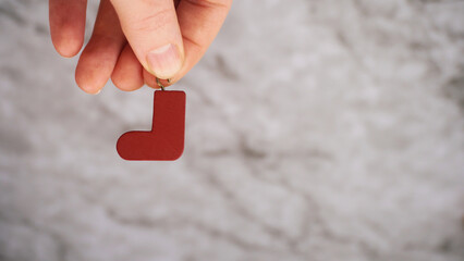 Christmas decoration in the shape of a red boot
A miniature wooden decoration in the form of a red boot. copy space