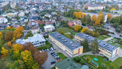 Obraz premium Aerial View of Suburban Neighborhood with School Complex