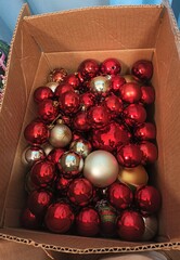 A full box of red Christmas toys