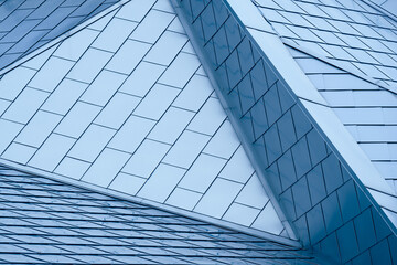 Steel roof of art museum forms abstract geometric background pattern