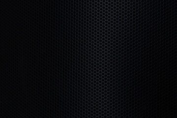 Naklejka premium Close-up of black speaker surface,Abstract black metal mesh texture for background. Industrial backdrop. Music pole speakers. High resolution horizontal photo.
