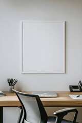 Fototapeta premium A sleek home office featuring a blank white poster frame above a wooden desk, paired with a stylish ergonomic chair and desk accessories.