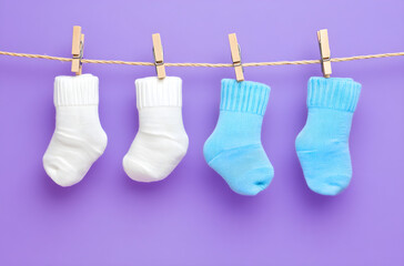 Cute and Colorful Baby Socks Drying on a String with Clothespins, AI GENERATIVE 