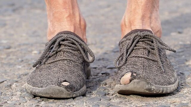 Worn men's moccasins.Rag gray moccasins with holes.