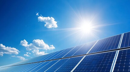 A vibrant blue sky shines over solar panels, reflecting sunlight and showcasing renewable energy technology.
