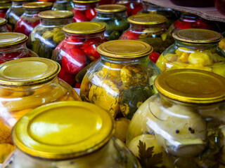 Rows of glass jars with canned vegetables