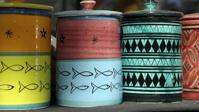 Colorful ceramic containers on display at a market showcasing artistic designs and vibrant patterns, Cours Mirabeau Market, Aix-en-Provence, Provence-Alpes-C&ocirc;te d'Azur, France
