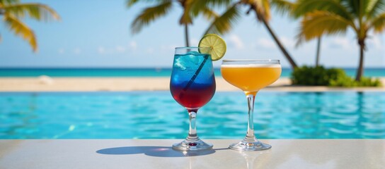 Two drinks at a resort pool overlooking the beach