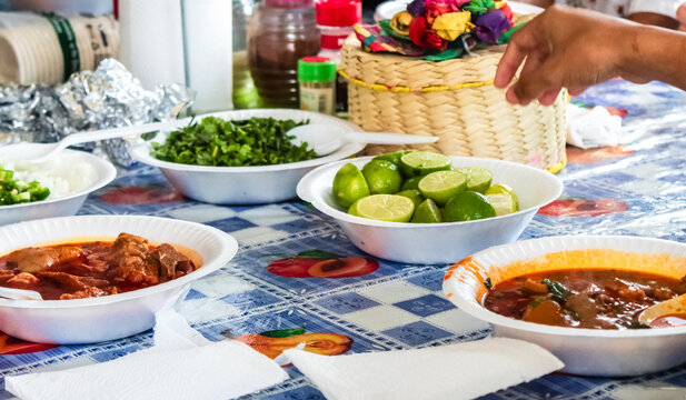 Family reunion enjoying a traditional mexican dish called pork backbone broth, better called "espinazo" in Matamoros, Tamaulipas, M&eacute;xico. 