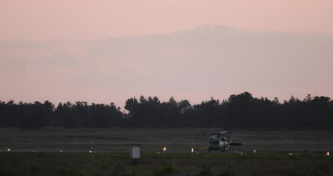 The helicopter is traveling on the runway at the airport. High quality 4k footage