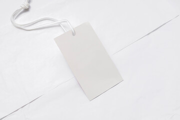 White paper and empty white cardboard price tag. For branding. Shopping sale