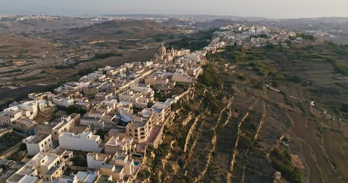 Exploring the Historic Streets and Parish Church of Zebbug on Gozo Island Through Aerial Views of MaltaArchitectural Beauty. High quality 4k footage