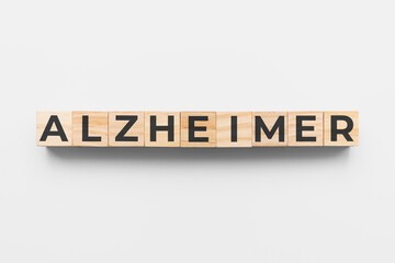 Alzheimer wooden cubes on grey background