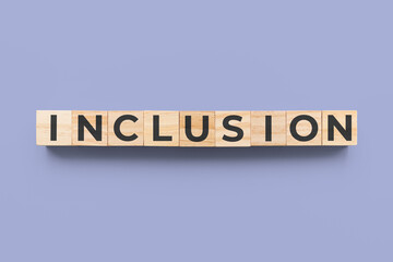 Inclusion wooden cubes on blue background