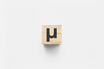 &micro; (Micro) wooden cube on white background