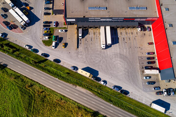 Aerial view of a logistics center with warehouse estates and docking transportation trucks at Biezanow hub in Kokotow district of Cracow in Poland