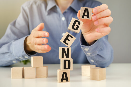 AGENDA - word on wooden cubes on a gray background