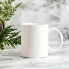 Obraz premium Empty white mug placed on a marble surface surrounded by greenery in a bright setting
