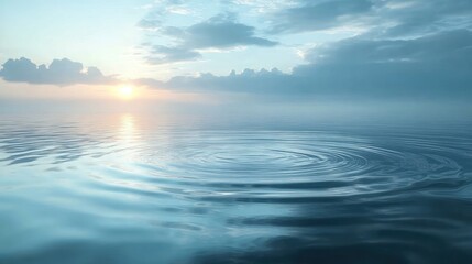 Obraz premium serene seascape at sunrise, showcasing gentle ripples on calm water under a cloudy sky 